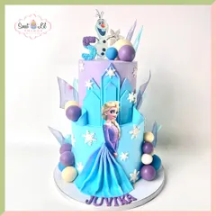 Let it go with this magical two-tiered Frozen cake. It features Elsa in her iconic blue dress, Olaf the snowman, and beautiful details like sugar snowflakes and ice shards, bringing the kingdom of Arendelle to life.