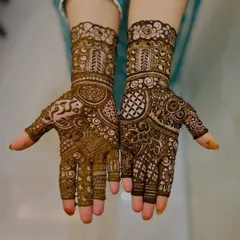 A beautiful example of a non-bridal Indian design, with a mix of bold patterns and fine lines. The different elements on each hand make it unique.