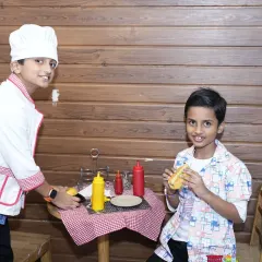 Welcome to our pretend play kitchen. Dressed as little chefs, these boys are learning and having fun as they "cook" up some delicious hot dogs for their friends.