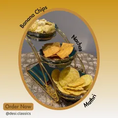 Create your own perfect snack platter with our dry munchies. This beautiful stand features our paper-thin Banana Chips, savory Moong Dal Nachos, and classic flaky Mathri. Order them individually or together for your next get-together.