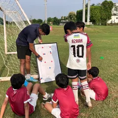 It's not just about drills, it's about strategy. Here, one of our AIFF certified coaches uses a tactical board to teach our U-10 players how to read the game, understand positioning, and make smarter decisions on the field.