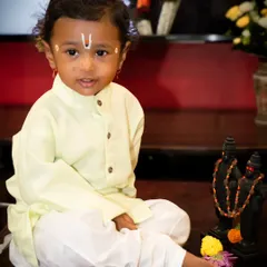 Here is our little Varkari in a moment of calm during his Ashadi Ekadashi themed shoot. The traditional tilak and serene pose look adorable.