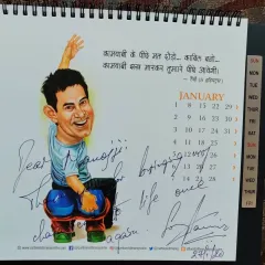 It was an honor when Aamir Khan ji himself requested my caricatures for his film festival posters. This is the calendar he personally signed for me, a testament to our collaboration. Working with such a perfectionist and receiving his appreciation is a milestone in my journey.