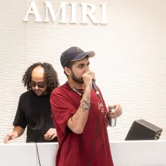 Music curation is about matching the sound to the space. Here I am on the decks with an artist during the launch of Amiri's first store in India, creating a sonic identity that complements the brand's high-end, rock-and-roll aesthetic.
