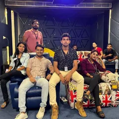 A closer look at the team enjoying our in-house media room. The custom wall panels you see are not just for looks; they are acoustic treatments that absorb echoes and improve sound clarity significantly.