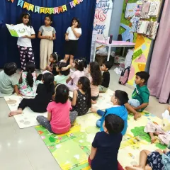 Another view of our young storytellers presenting 'Pete the Cat'. They work as a team to narrate the story, building their confidence and public speaking skills in a supportive environment.