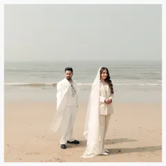 A modern couple against the timeless expanse of the sea. The bride's choice of a pantsuit and veil speaks to her unique personality, a story I was honored to tell. This portrait shows my love for capturing weddings that are authentic and unconventional.
