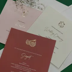 A closer look at the inserts from our classy and minimal suite. Each card for the Sangeet, Wedding Ceremony, and Reception features a unique color and a small gold-foiled icon representing the event.