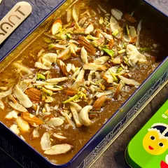Experience the taste of Kerala with our delectable Parippu Pradhaman, a perfect blend of moong dal and rich coconut milk, garnished with nuts.
