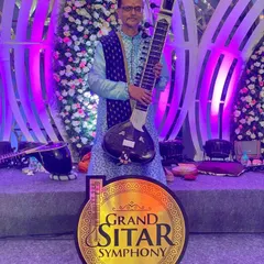 This sitar is my companion. Music is my life and my devotion, a feeling I pour into every performance to share a sense of peace and *bakthi* with the audience.