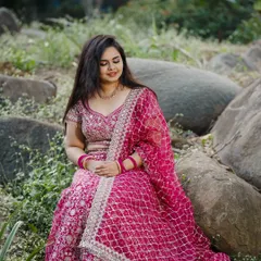 A serene portrait of Dr. Meghana. Her soft makeup and flowing hair create a romantic and beautiful look for her engagement photos.