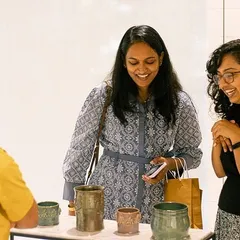 Visitors admiring the work at our student exhibit. The support from the community means the world to us and our artists.