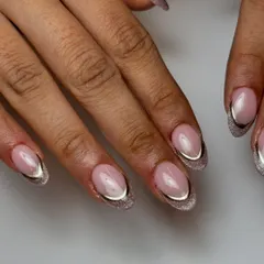 A modern and chic design featuring a cat-eye French tip. The magnetic polish creates a beautiful shimmer, outlined with a sharp silver chrome line for extra definition.