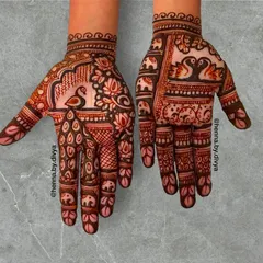 This design is a celebration of traditional motifs. It features a proud peacock, graceful swans, lotus flowers, and a procession of small elephants.