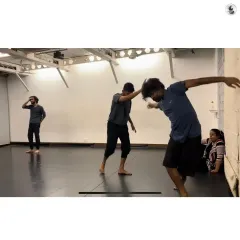 A moment of focused movement during our workshop. We guide participants through exercises that build a deep connection with different parts of the body.