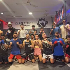 All smiles after a hard sparring session. Moments before, these fighters were pushing each other to the limit, a testament to the respect and camaraderie we build in our gym.