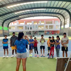 Giving back to the next generation is incredibly important to me. Here, I'm talking with young players at an academy about practical mental strategies like meditation and visualization. Seeing their focus and curiosity is a powerful reminder of why I do what I do.