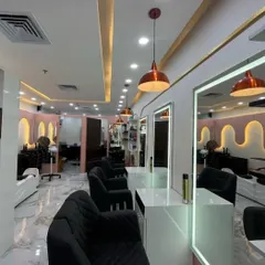 Welcome to our modern and stylish salon space. We've created a clean, comfortable, and professional atmosphere with well-lit stations and premium chairs, so you can relax and enjoy your grooming session.