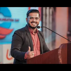 A thumbs-up from the podium during a corporate foundation day. It's my way of signaling that everything is going great and we're all having a good time.