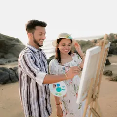 A fun, interactive moment as he helps her with the painting. Themed photoshoots like this create unique and personal memories.