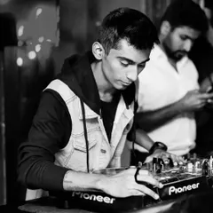 A quiet moment of focus before the beat drops. It's all about timing and feeling the rhythm of the room.