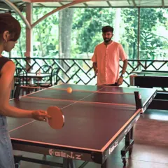 A friendly match of table tennis is a great way to stay active and bond with teammates, all while surrounded by the calming greenery of our resort.