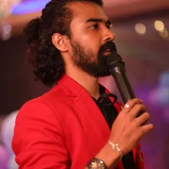A close-up shot of me in a bright red jacket, focused on hosting and engaging with the audience.