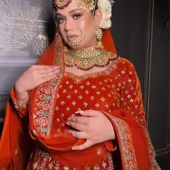 This shot highlights the complete bridal look, pairing the custom velvet outfit with a full set of traditional jewelry. I work with you to ensure the neckline and design of the outfit complement your chosen accessories perfectly.