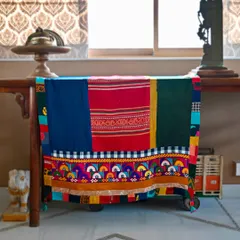 The reverse side of the chadar reveals a different personality, highlighting the striped patterns of the Laotian hemp and the solid color blocks of the Kala cotton.