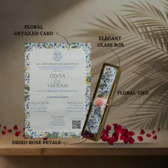This invitation feels like a gift in itself. Our floral scroll comes in an elegant glass box, surrounded by dried rose petals for a truly romantic presentation.