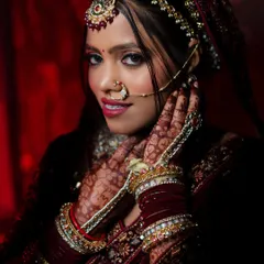 The beauty of a North Indian bride is in the details. I use dramatic lighting to highlight the intricate henna, the rich colors of the lehenga, and the bride's confident gaze, creating a powerful and artistic bridal portrait.
