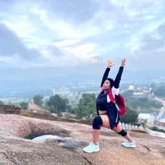Taking my practice outdoors while trekking at Shivagange. Even during recovery, movement is key. Here, I'm wearing a knee brace while holding a warrior pose, adapting my practice to what my body needs and proving that you can stay active and strong through every phase of healing.