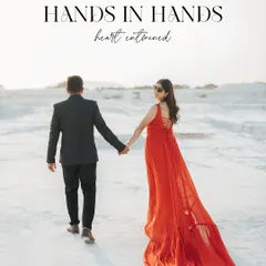 A classic "follow me to" style shot in a stunning white quarry. The bride's vibrant red dress with its long train creates a breathtaking trail of color against the minimalist background.