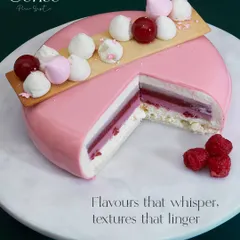 Here you can see the heart of my craft. This cross section reveals the delicate layers of berry compote, light mousse, and soft sponge, all working in harmony. Flavours that whisper, textures that linger.