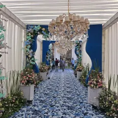 A stunning blue and white floral printed carpet creates a unique and picturesque walkway for this engagement ceremony at Luxera.