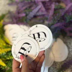 Personalized tags that tell your story. For a wedding, we created these beautiful tags with the couple's initials to add a bespoke touch to their return favors.