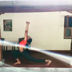 This low lunge stretch, Ashwa Sanchalanasana, is fantastic for relieving cramps in the lower body and pulls in the spine from long hours of sitting. Holding it for just 10 to 20 seconds on each side can provide quick relief.