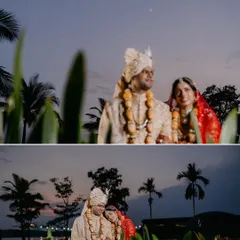 The couple shares a quiet moment together as dusk settles, with the twilight sky and palm trees creating a romantic, serene backdrop.