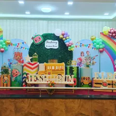 A Christening ceremony with a fun Cocomelon theme. I integrated character cutouts, a faux grass wall, and colorful balloon garlands to make the event special for the whole family.