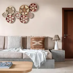 Another image from the India Today Home feature, showing the family room's custom concrete seating and earthy, boho decor. This space was designed to be a cozy and inviting retreat.