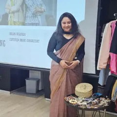 Ready for a power dressing training session. The setup includes a presentation, a rack of curated clothing from Indyvarna, and accessories to provide a complete, hands-on styling experience.