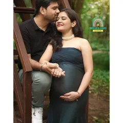 An intimate moment shared between the expecting parents during their outdoor maternity shoot. We guide our couples into poses that feel natural and highlight their connection.