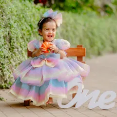 A little princess in a stunning rainbow dress for her first birthday photoshoot. I love incorporating vibrant colors and fun outfits to make the photos pop.