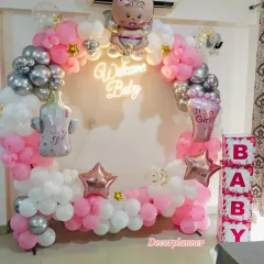 There's nothing like the joy of bringing your little one home. I designed this beautiful circular balloon arch in soft pinks and shimmering silvers, centered with a "Welcome Baby" neon sign to create the perfect, warm welcome for a new princess.