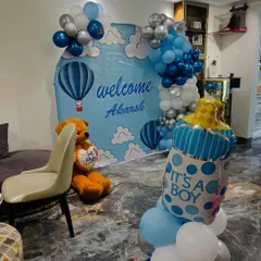 Another angle of the 'Welcome Baby' setup, showing the 'It's a Boy' foil balloon.