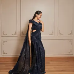 A full-length view of our Glamour gown. The sequined fabric sparkles beautifully, and the attached trail adds a touch of drama.