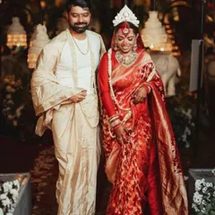 A beautiful portrait of Oishi and Arpit from their traditional Bengali wedding, as featured in Vogue Weddings. The decor featured classic white elements, including elephant statues and tuberose flowers.