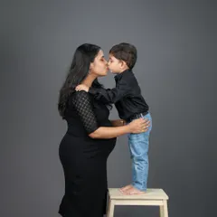A beautiful moment of love as a big brother-to-be gives his mom a sweet kiss. Family maternity sessions are a wonderful way to capture the love that’s already there as you wait for the new arrival.