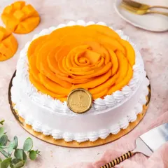 Our Mango Fresh Cream Cake is a light and refreshing summer treat. It's topped with a beautiful rosette of thinly sliced fresh mangoes, making it as beautiful as it is delicious.