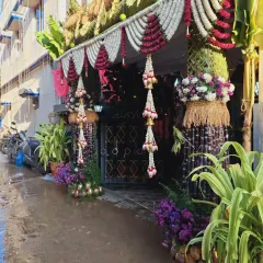 A side perspective of the entrance decor, showing how it frames the doorway of the home.